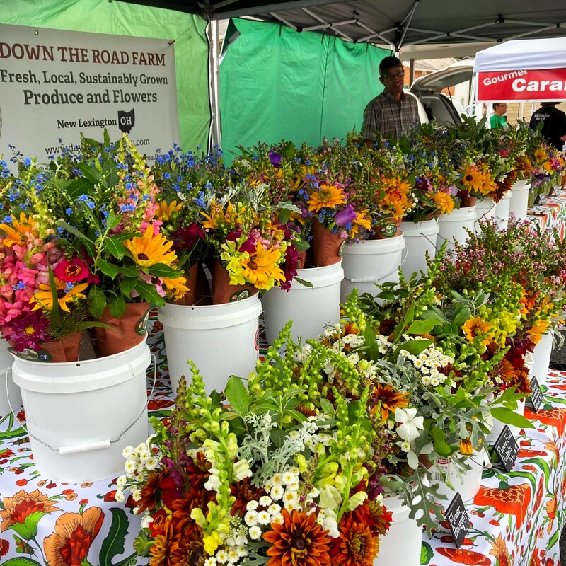 flower farmer with fresh flower bouquet display at the Lancaster Farmers Market in Ohio